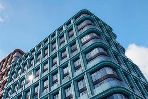 Sminex создает квартал с фасадами из бирюзового кирпича и 3D-камня Sminex создает квартал с фасадами из бирюзового кирпича и 3D-камня